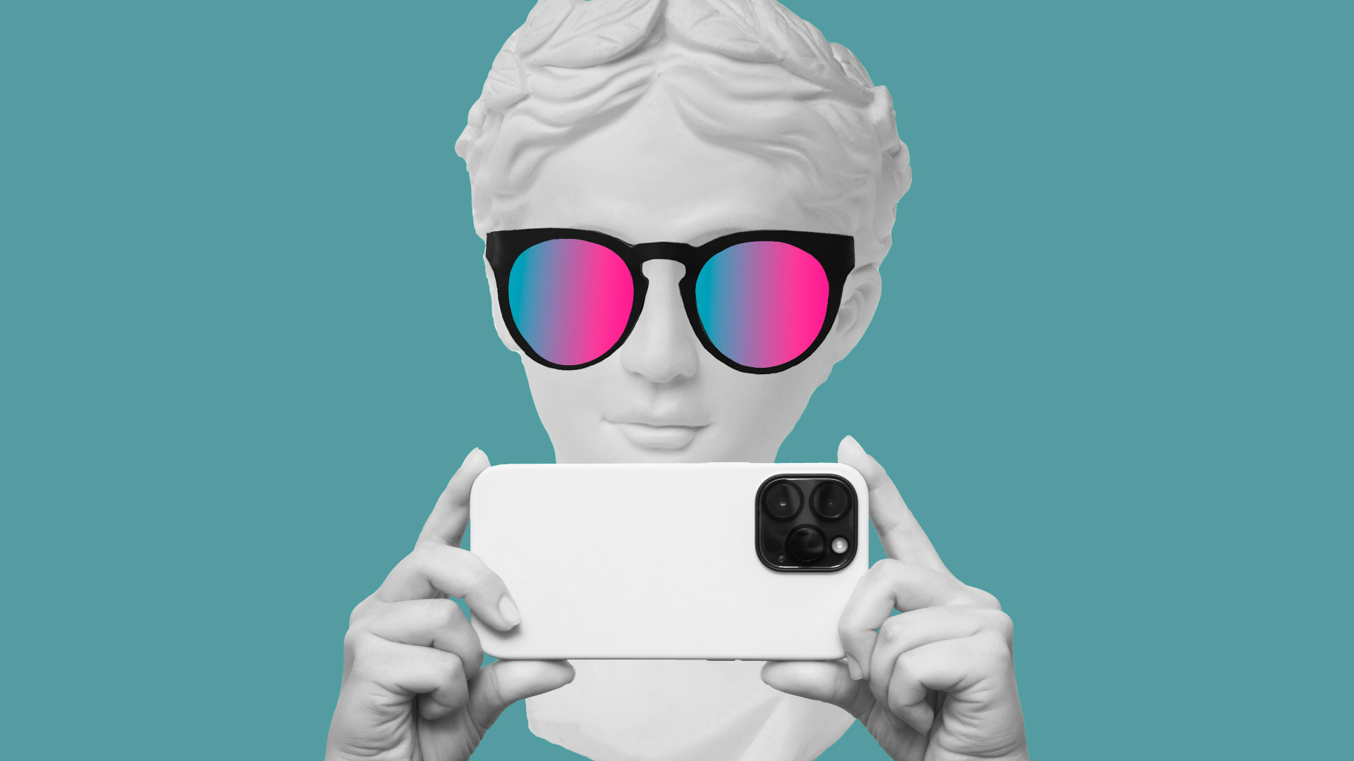 A marble statue wearing rainbow-tinted glasses holds a smartphone.